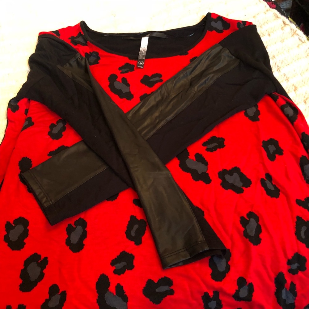Leopard print tunic with leather trim on sleeves